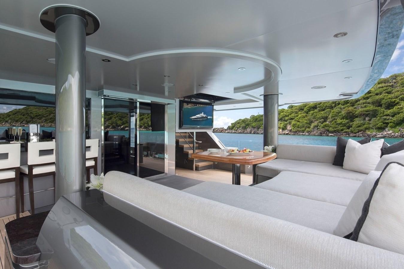 a room with a couch and a table aboard MUCHOS MAS Yacht for Sale