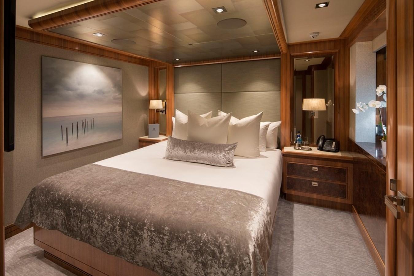 a large bed in a hotel room aboard MUCHOS MAS Yacht for Sale