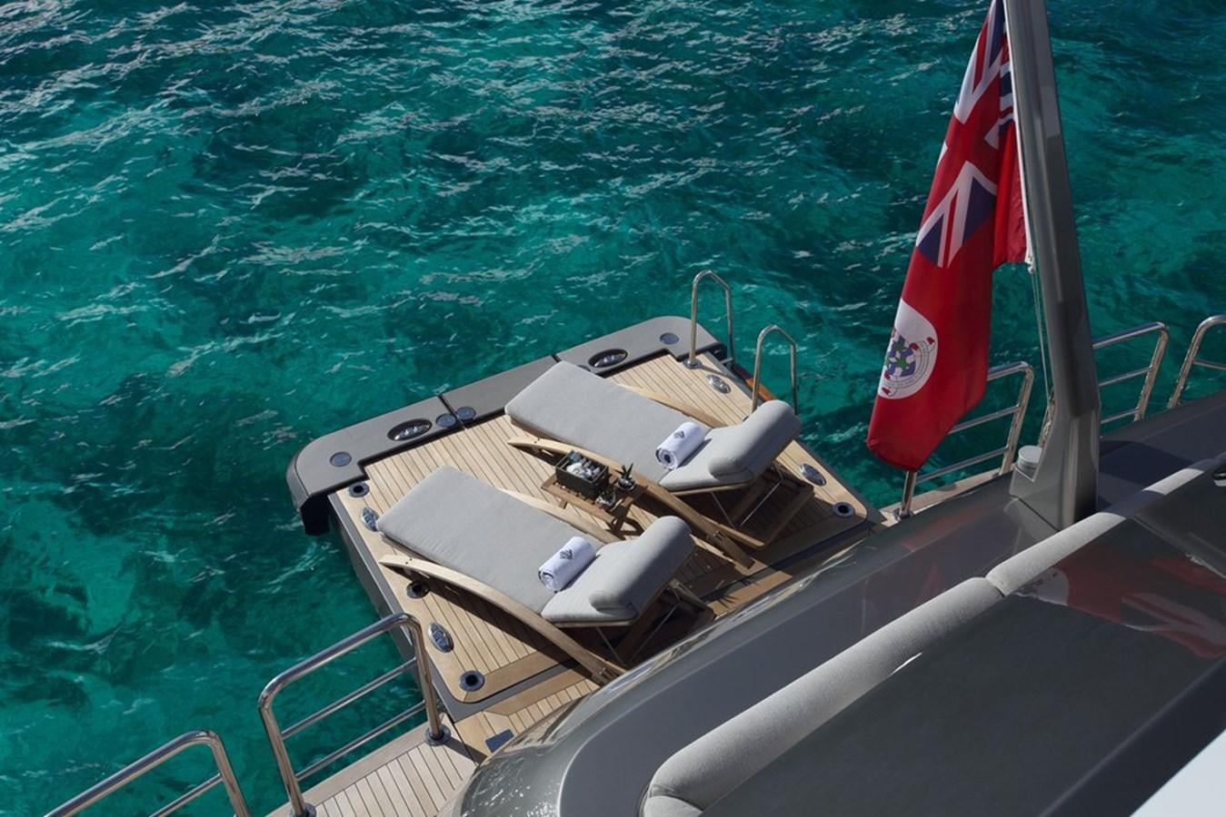 a boat on the water aboard MUCHOS MAS Yacht for Sale