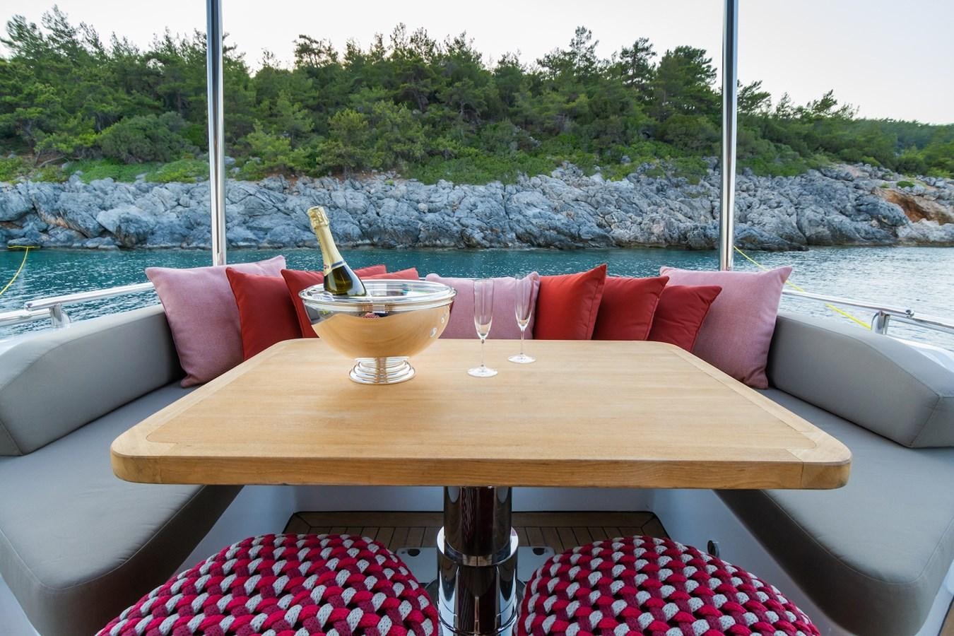 a table with a bowl and a bowl on it aboard AXELLA Yacht for Sale