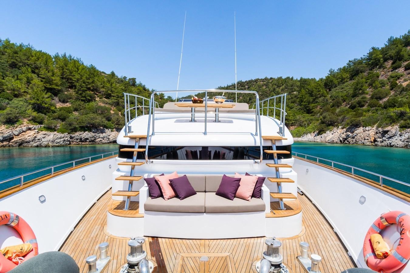 a boat on a water body aboard AXELLA Yacht for Sale