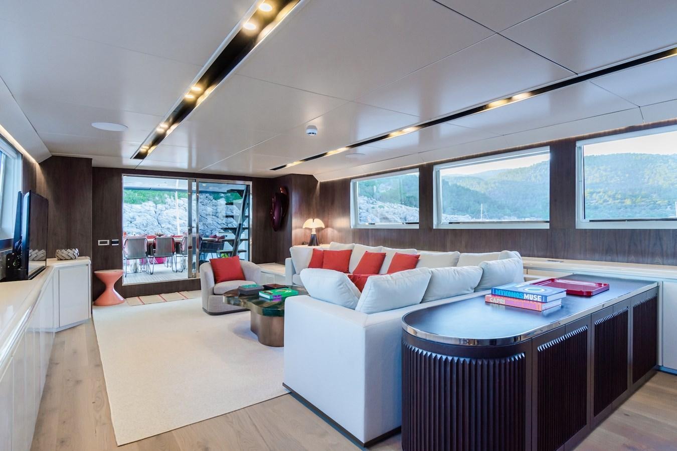 a living room with a large window aboard AXELLA Yacht for Sale