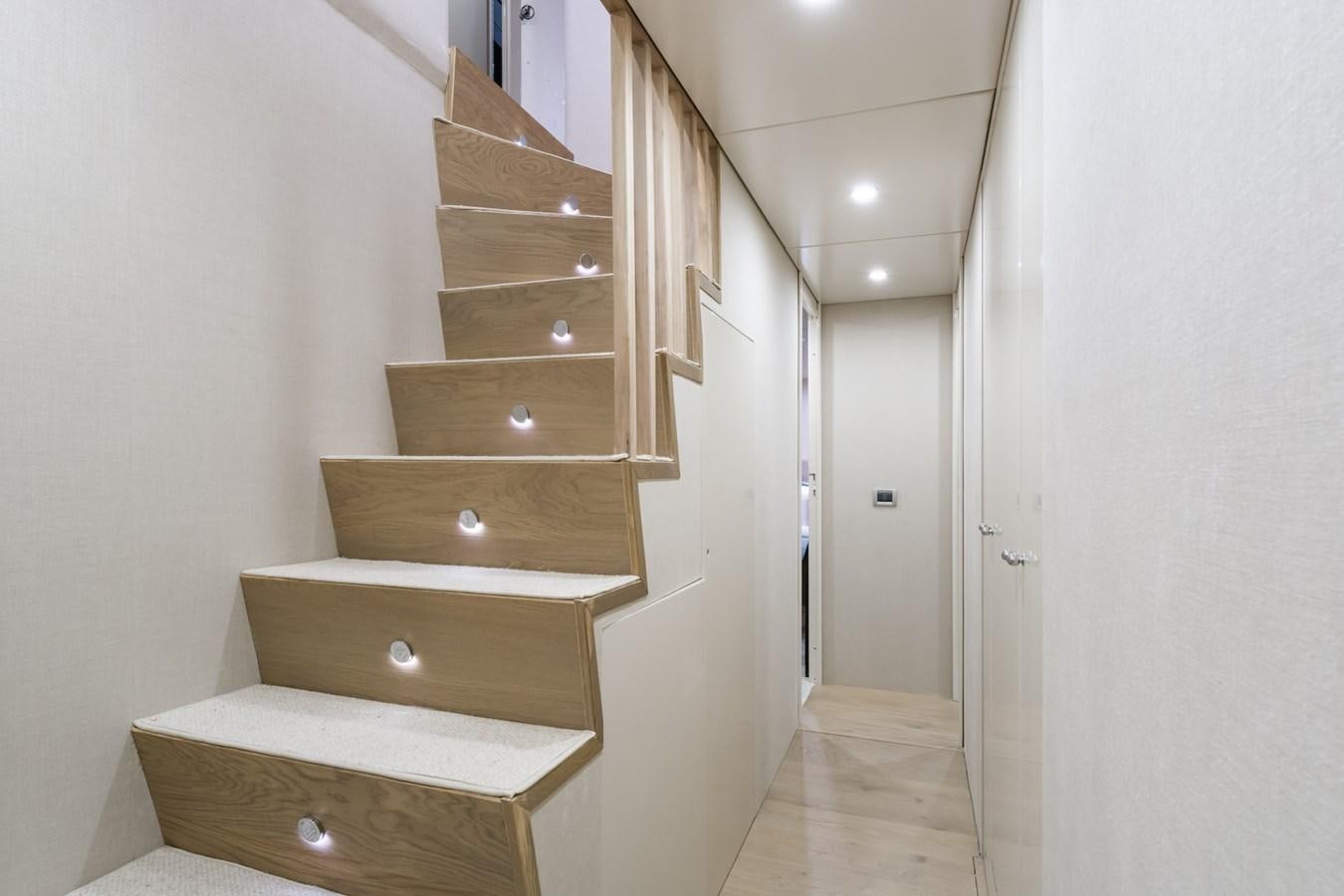 a wooden staircase in a room aboard AXELLA Yacht for Sale