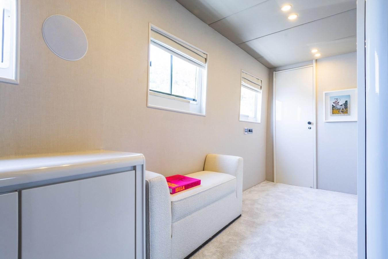 a room with a bed and a desk aboard AXELLA Yacht for Sale
