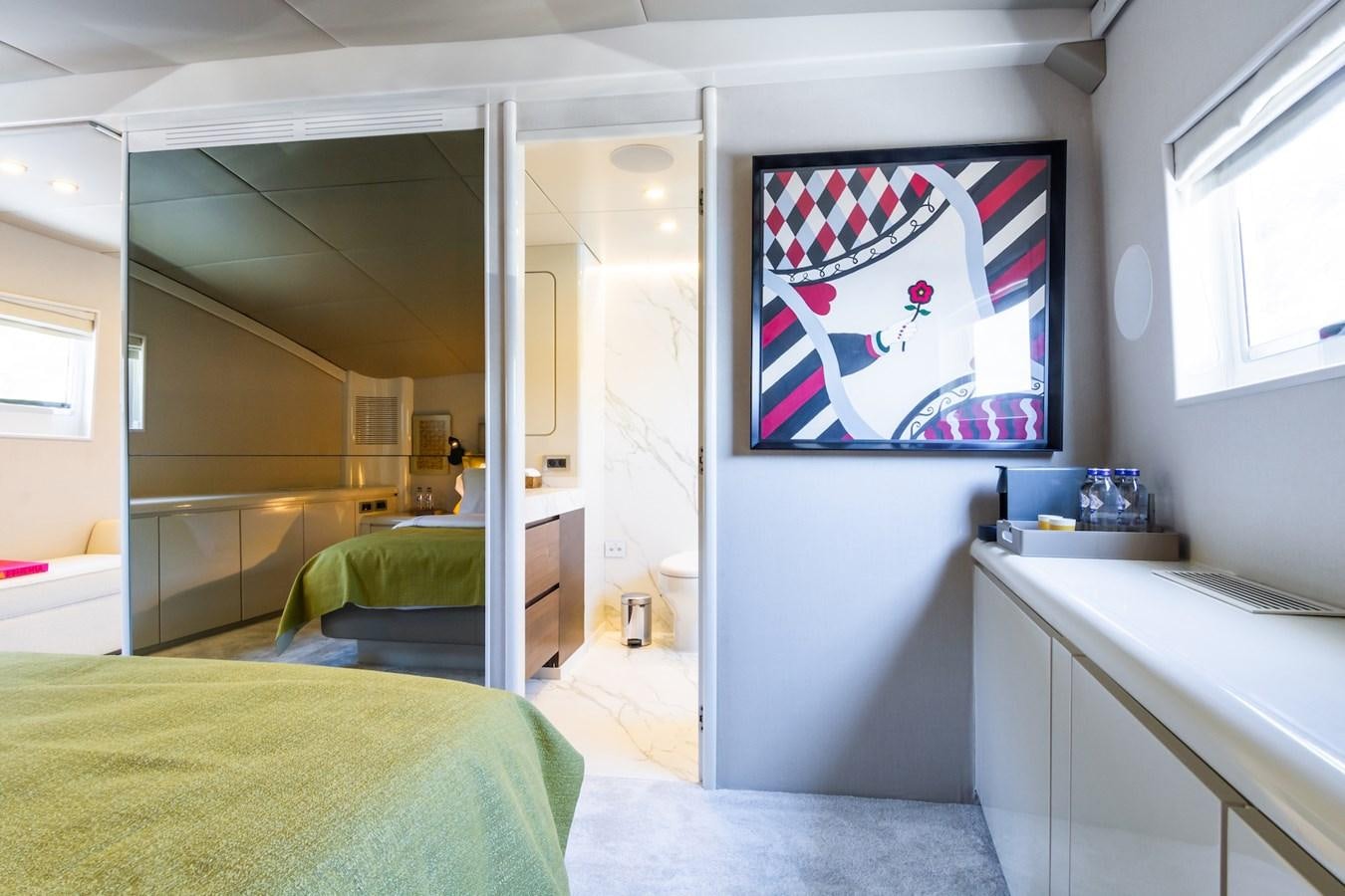 a bathroom with a bed and sink aboard AXELLA Yacht for Sale