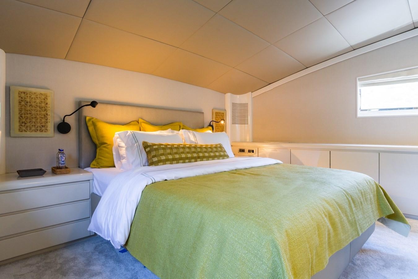 a couple of beds in a room aboard AXELLA Yacht for Sale