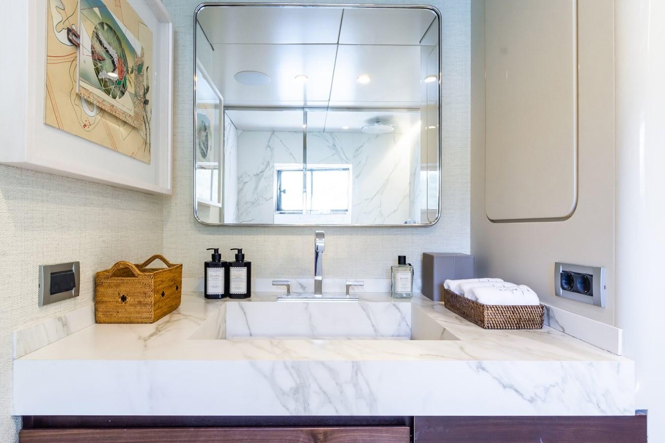 a bathroom with a large mirror aboard AXELLA Yacht for Sale
