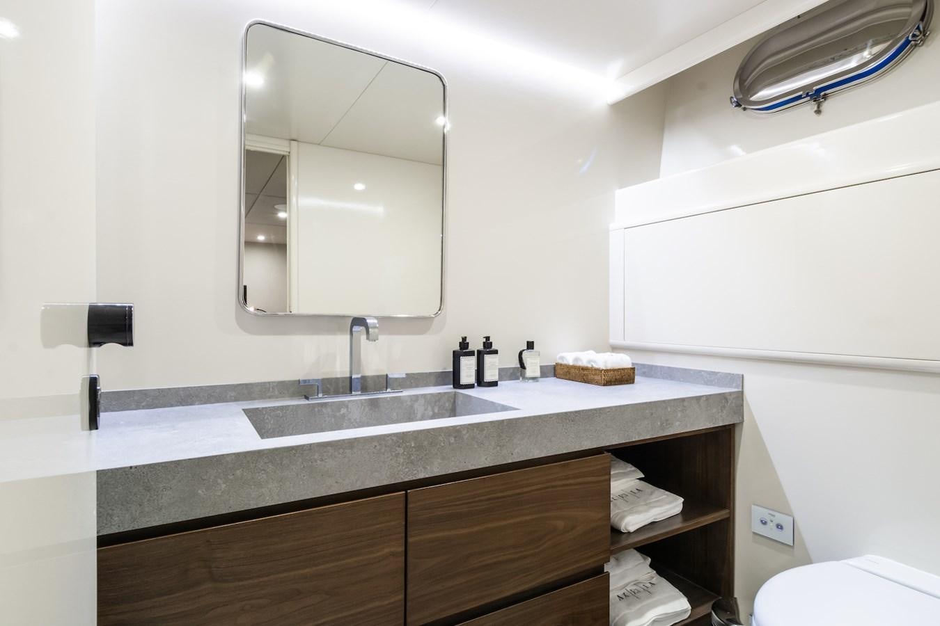 a bathroom with a large mirror aboard AXELLA Yacht for Sale