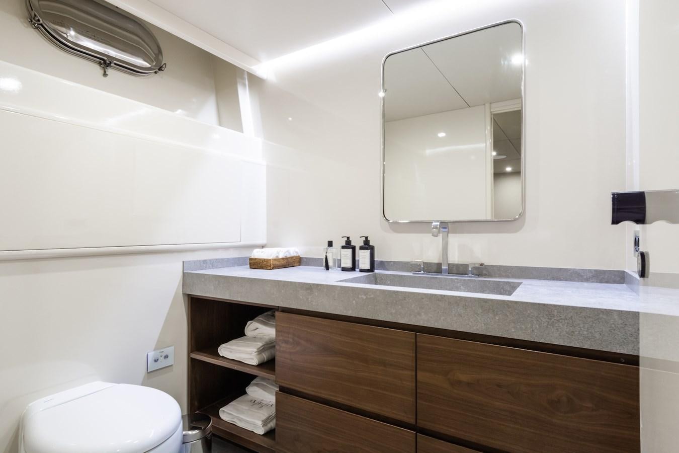 a bathroom with a sink and a mirror aboard AXELLA Yacht for Sale