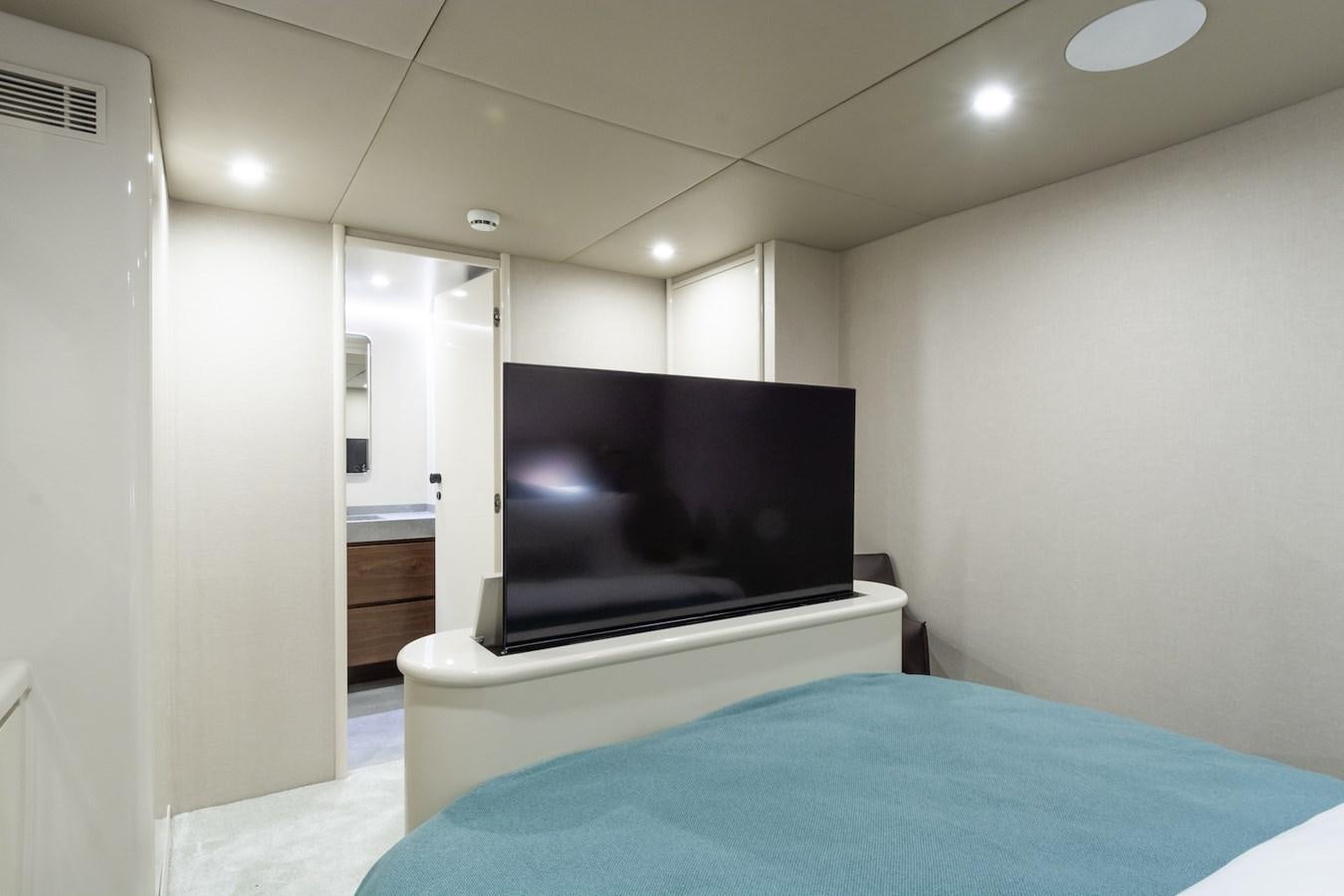 a tv on a stand in a room aboard AXELLA Yacht for Sale