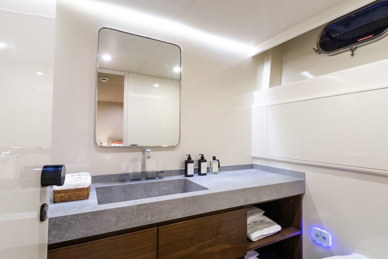 a bathroom with a large mirror aboard AXELLA Yacht for Sale