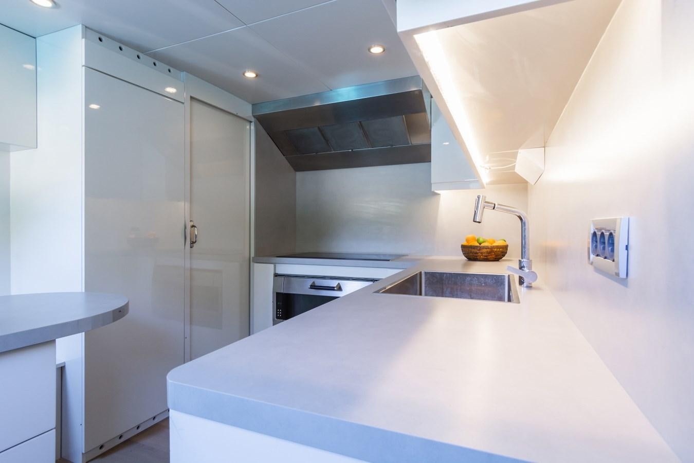 a kitchen with a sink and cabinets aboard AXELLA Yacht for Sale