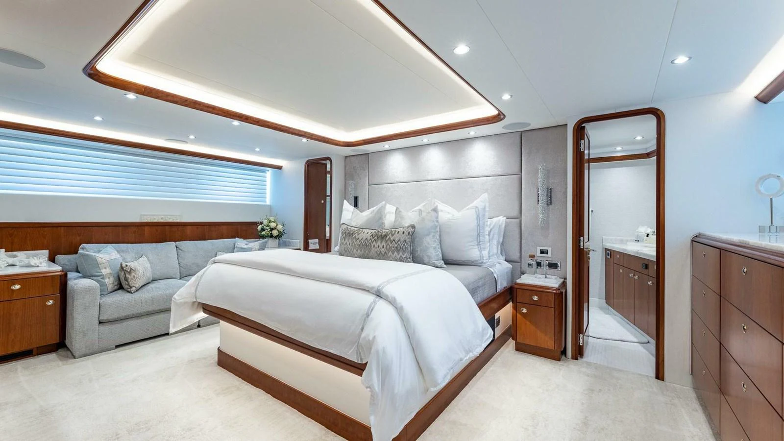 a bedroom with a bed and a couch aboard NO SHORTCUTS Yacht for Sale