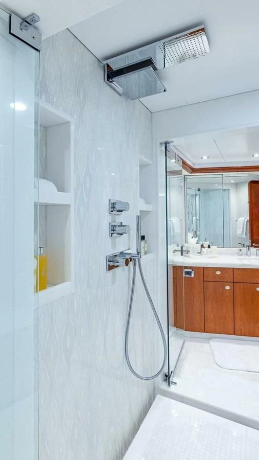 a white bathroom with a shower aboard NO SHORTCUTS Yacht for Sale