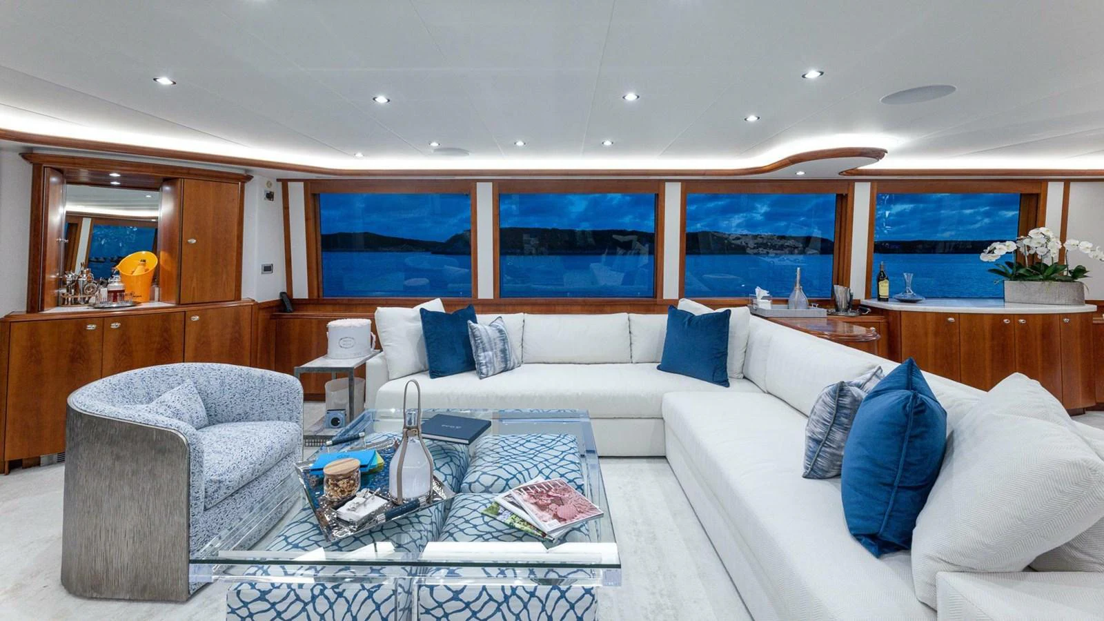 a living room with a couch and a table aboard NO SHORTCUTS Yacht for Sale