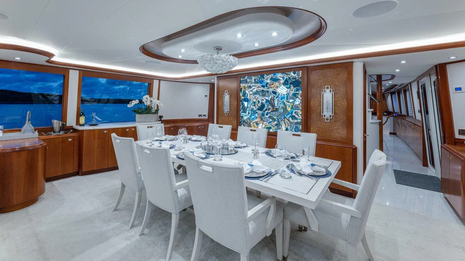 a large dining room with a large table and chairs aboard NO SHORTCUTS Yacht for Sale