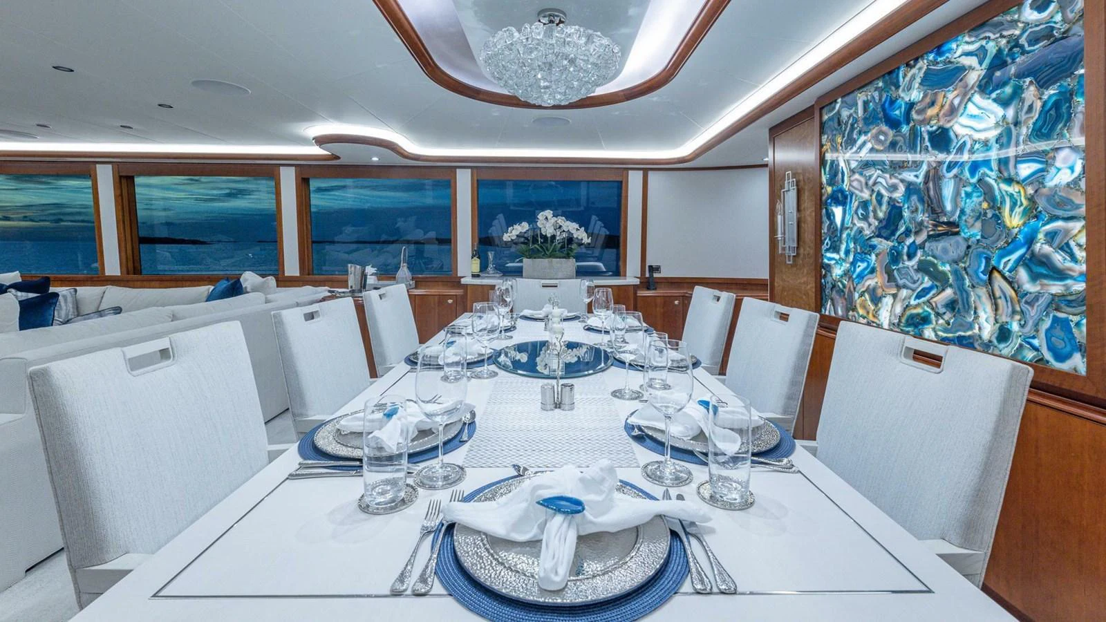 a large white table with plates and glasses on it aboard NO SHORTCUTS Yacht for Sale