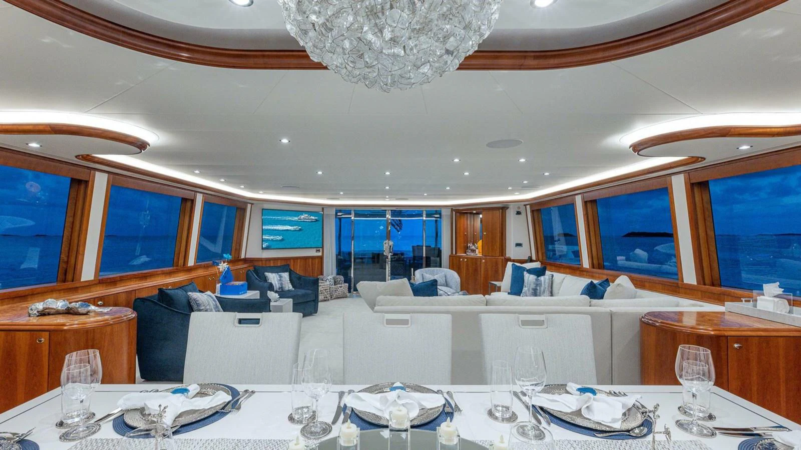 a large room with a table and chairs aboard NO SHORTCUTS Yacht for Sale