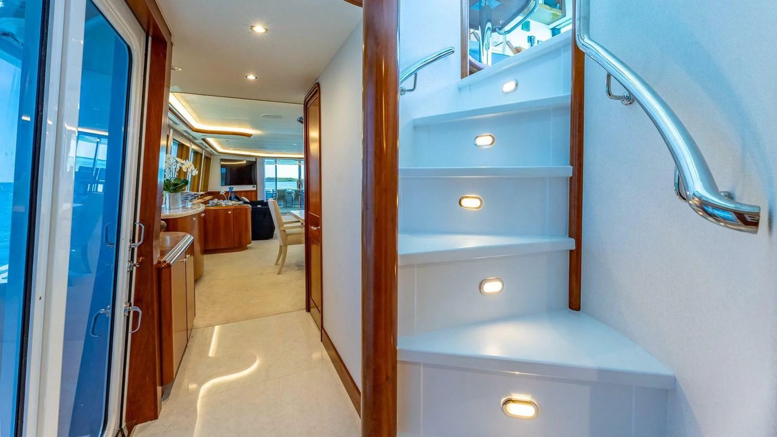 a room with a door and a table with chairs aboard NO SHORTCUTS Yacht for Sale