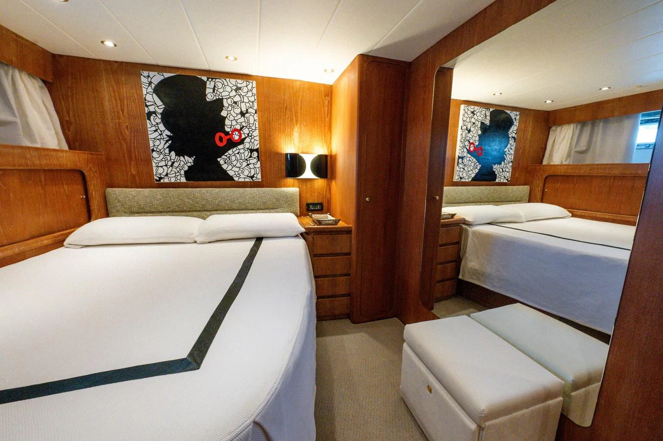 a room with beds and a painting aboard VIS Yacht for Sale