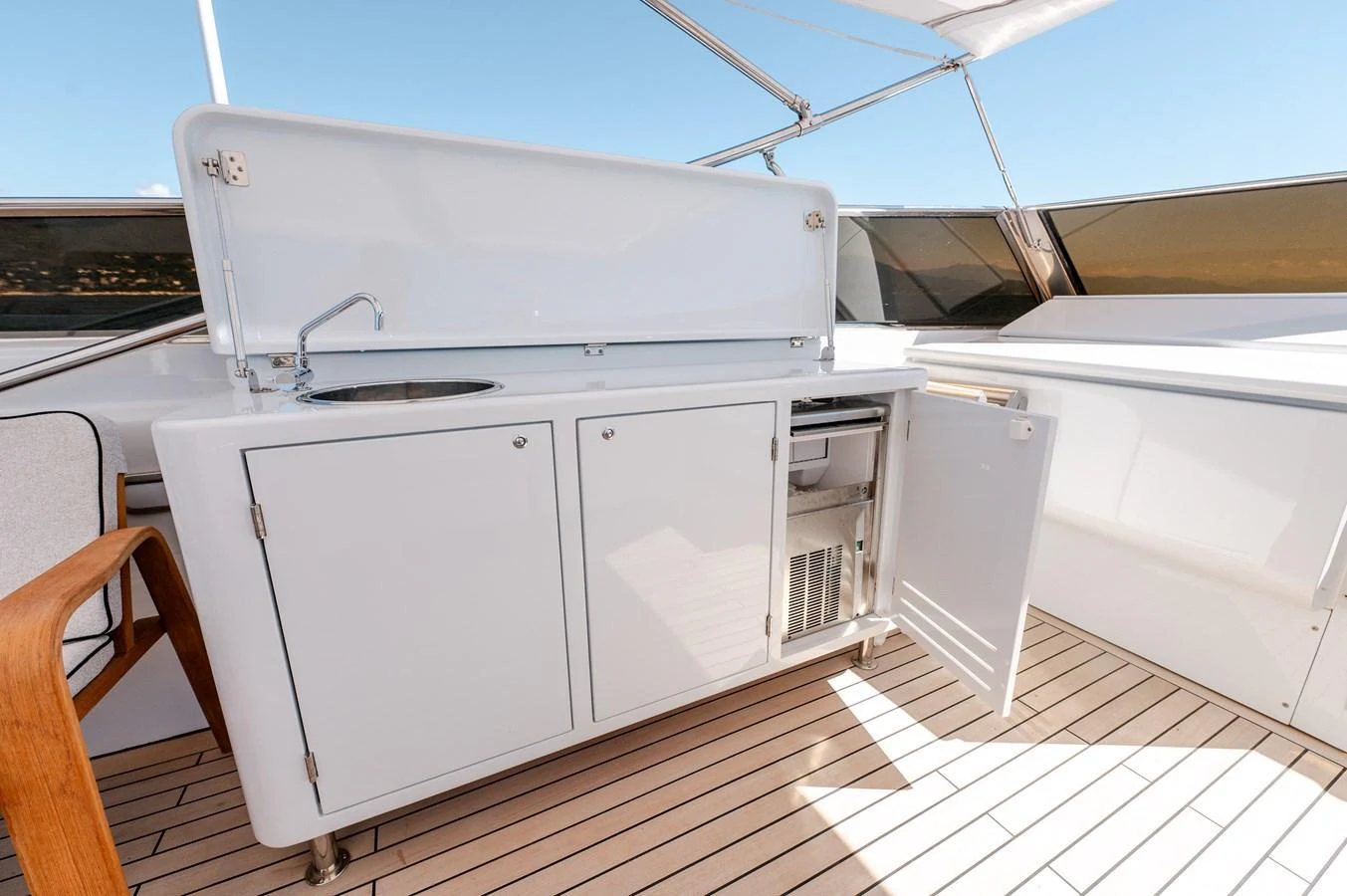 a kitchen with white cabinets aboard VIS Yacht for Sale