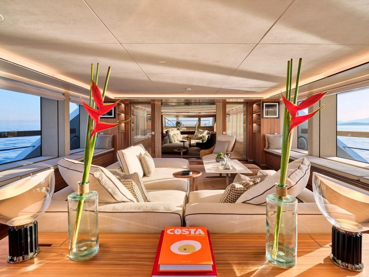 a table with a vase of flowers aboard PARA BELLUM Yacht for Sale