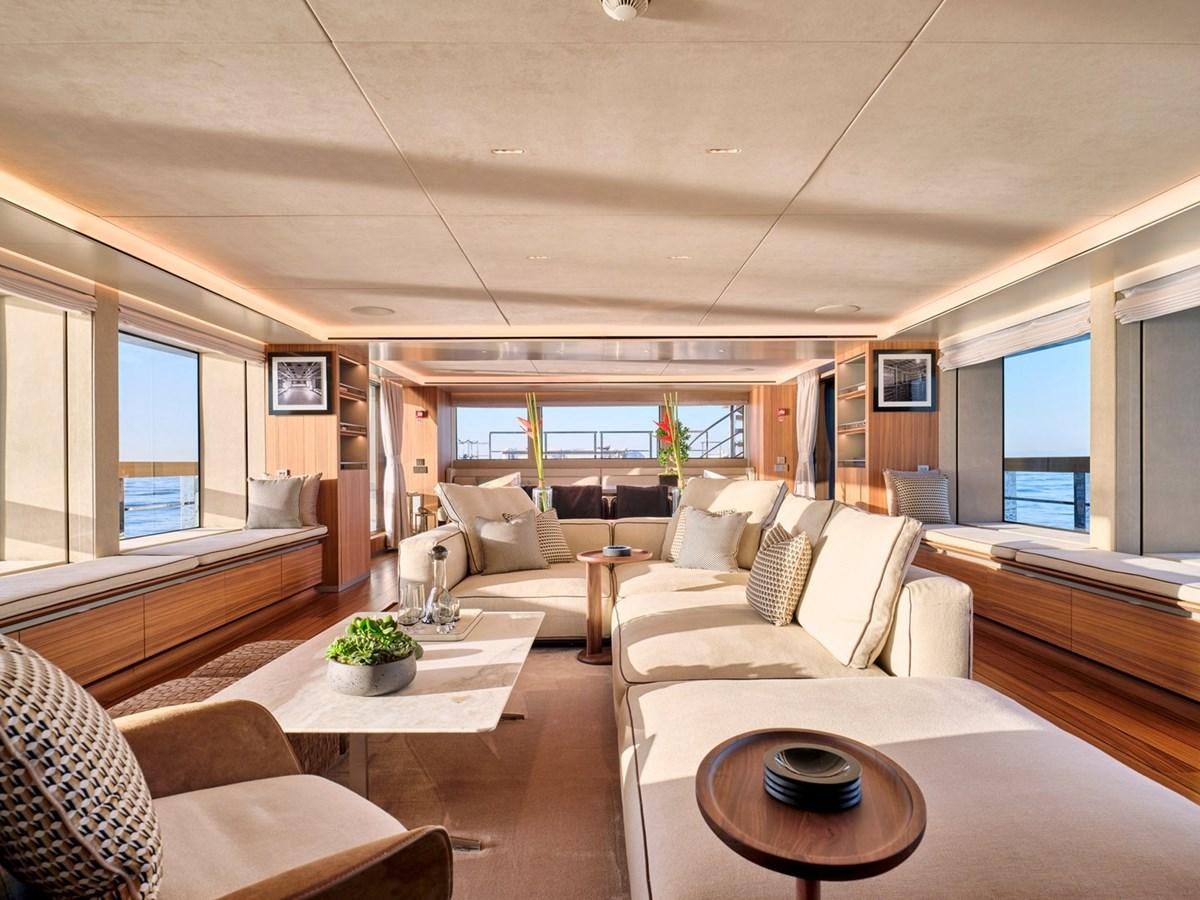 a living room with a large window aboard PARA BELLUM Yacht for Sale
