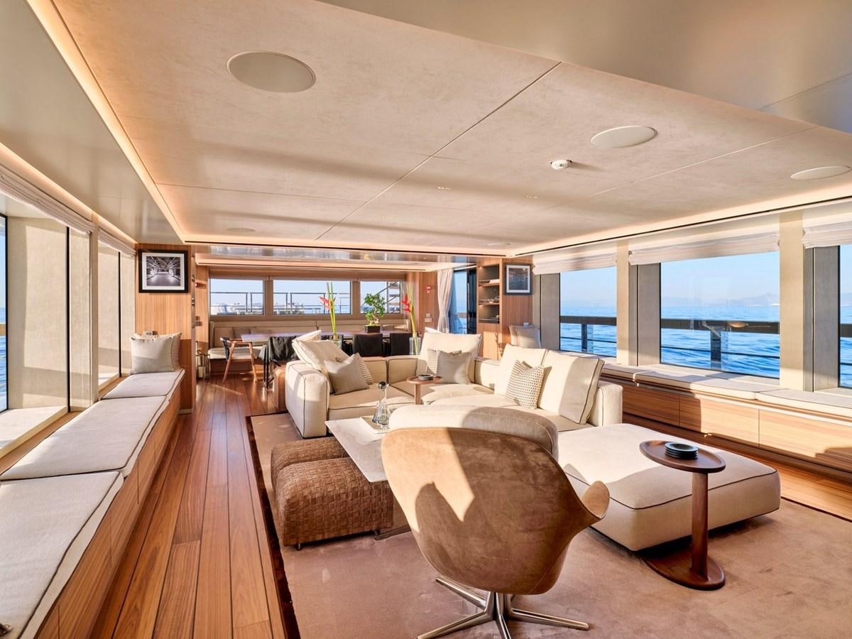 a large living room with a large window aboard PARA BELLUM Yacht for Sale