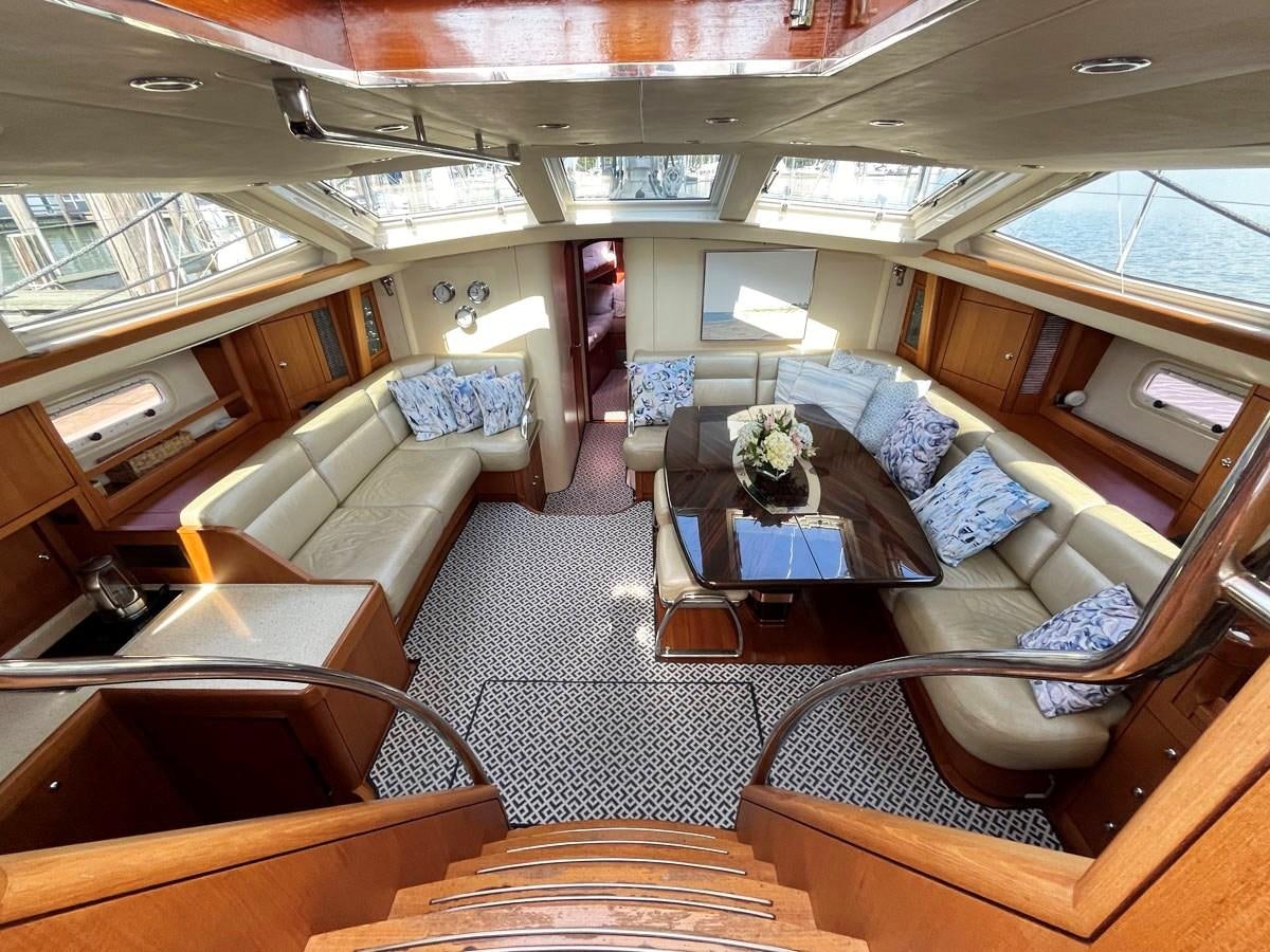 a room with a couch and a table aboard WEATHERLY Yacht for Sale