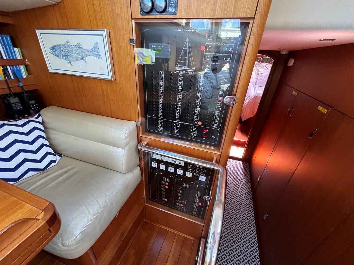 a living room with a tv aboard WEATHERLY Yacht for Sale