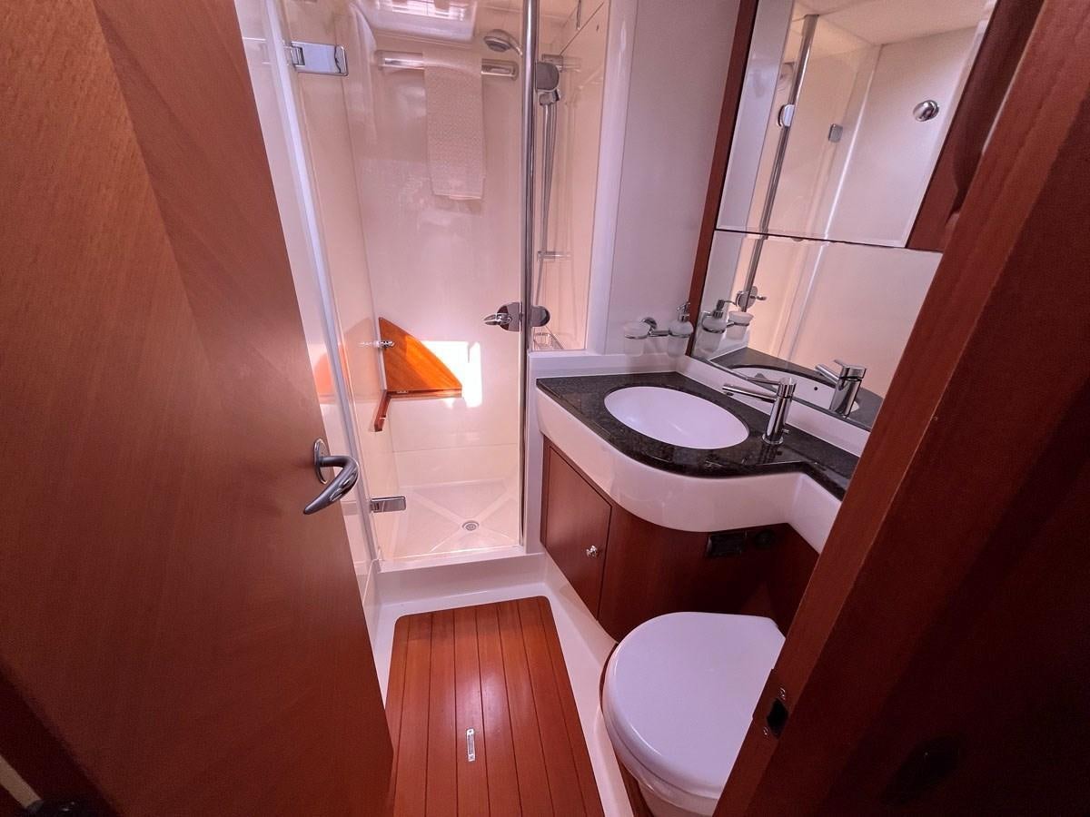 a bathroom with a sink and toilet aboard WEATHERLY Yacht for Sale