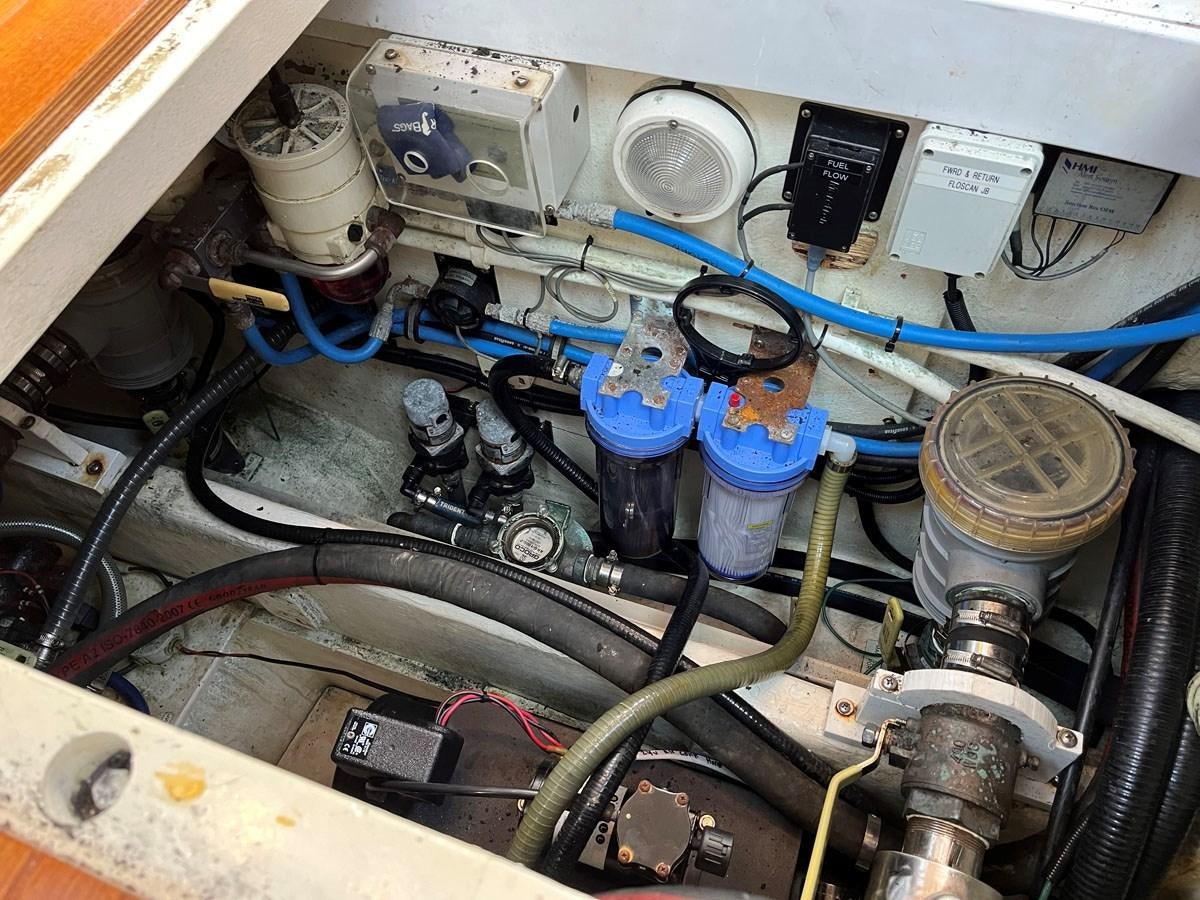 a person working on a machine aboard WEATHERLY Yacht for Sale