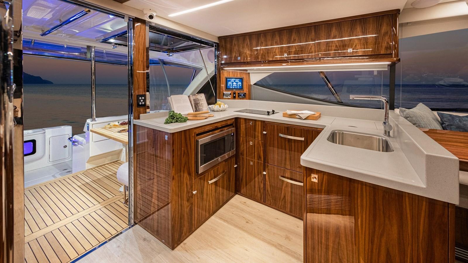 a kitchen with a sink and cabinets aboard 72 SPORTS MOTOR YACHT Yacht for Sale