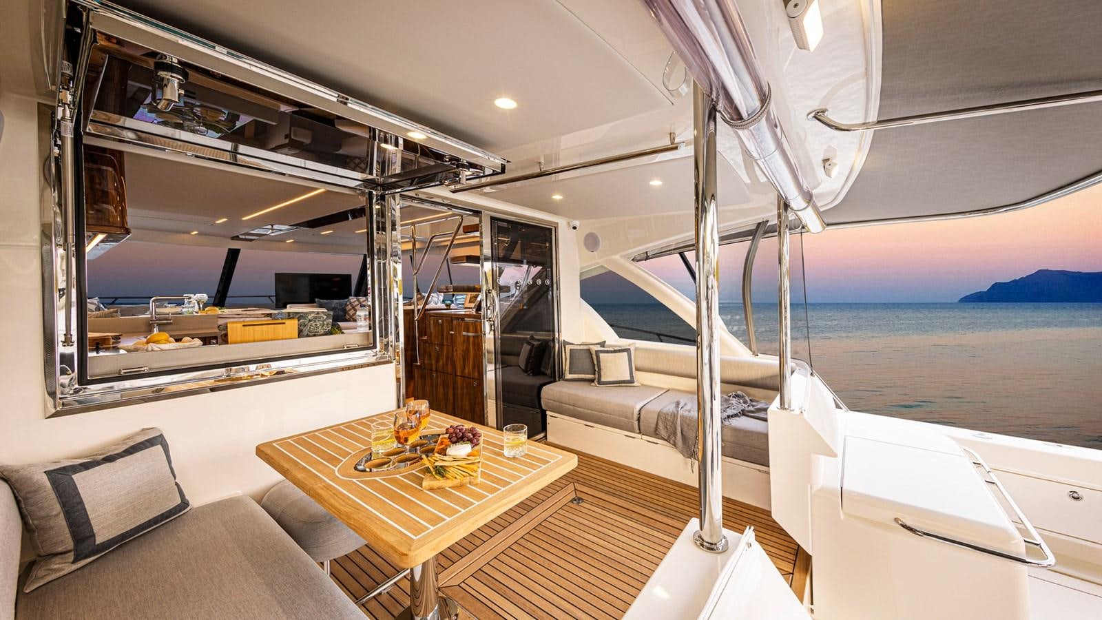 a room with a table and a bed aboard 72 SPORTS MOTOR YACHT Yacht for Sale