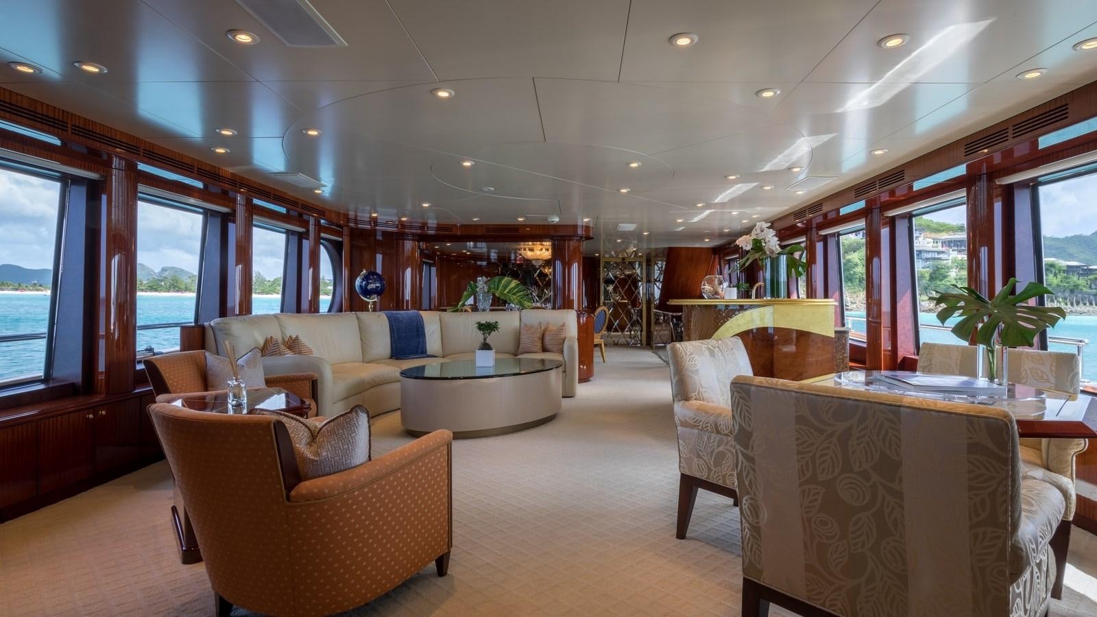 a living room with a table and chairs aboard TOUCH Yacht for Sale