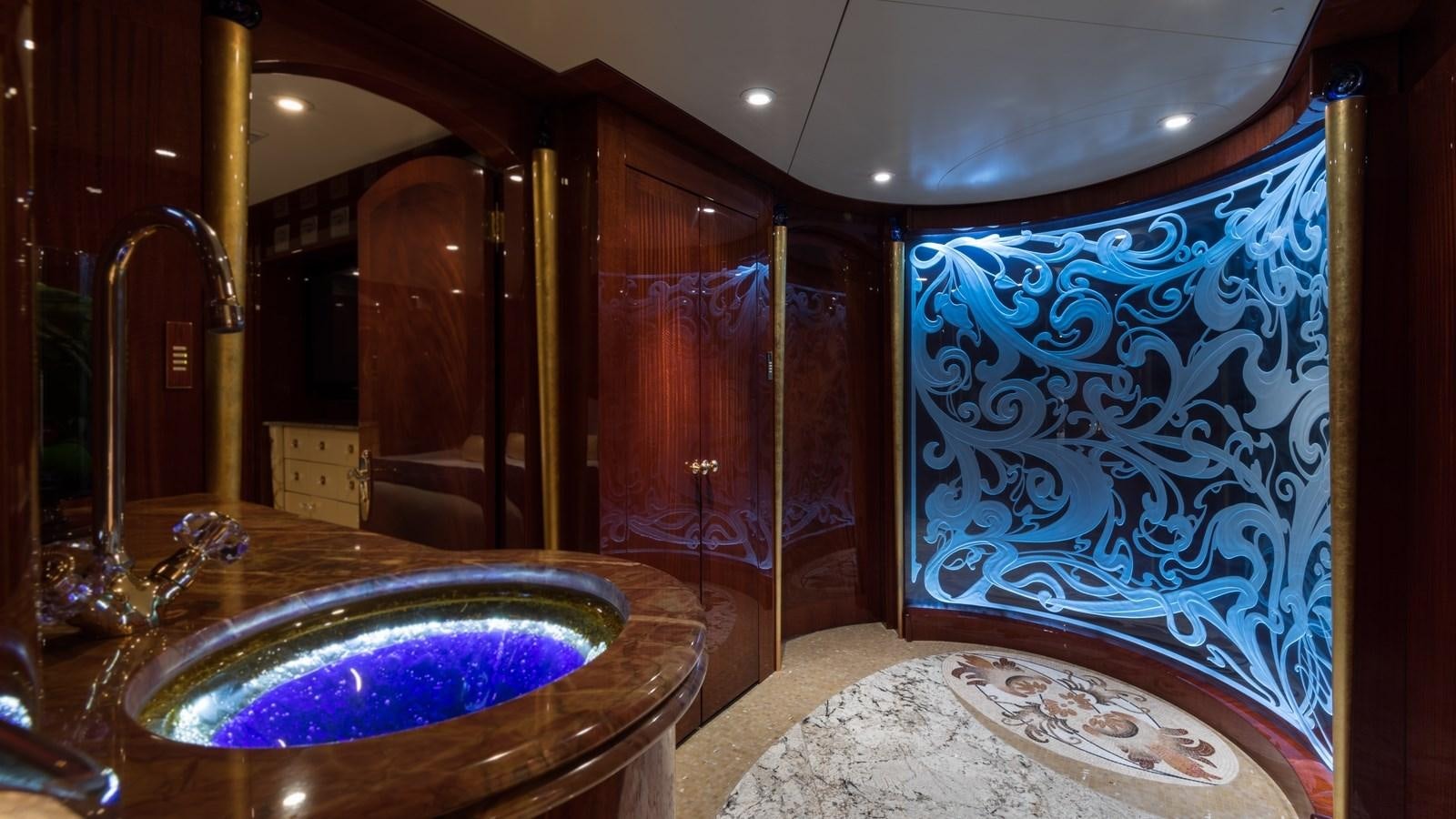 a fancy bathroom with a large round tub aboard TOUCH Yacht for Sale