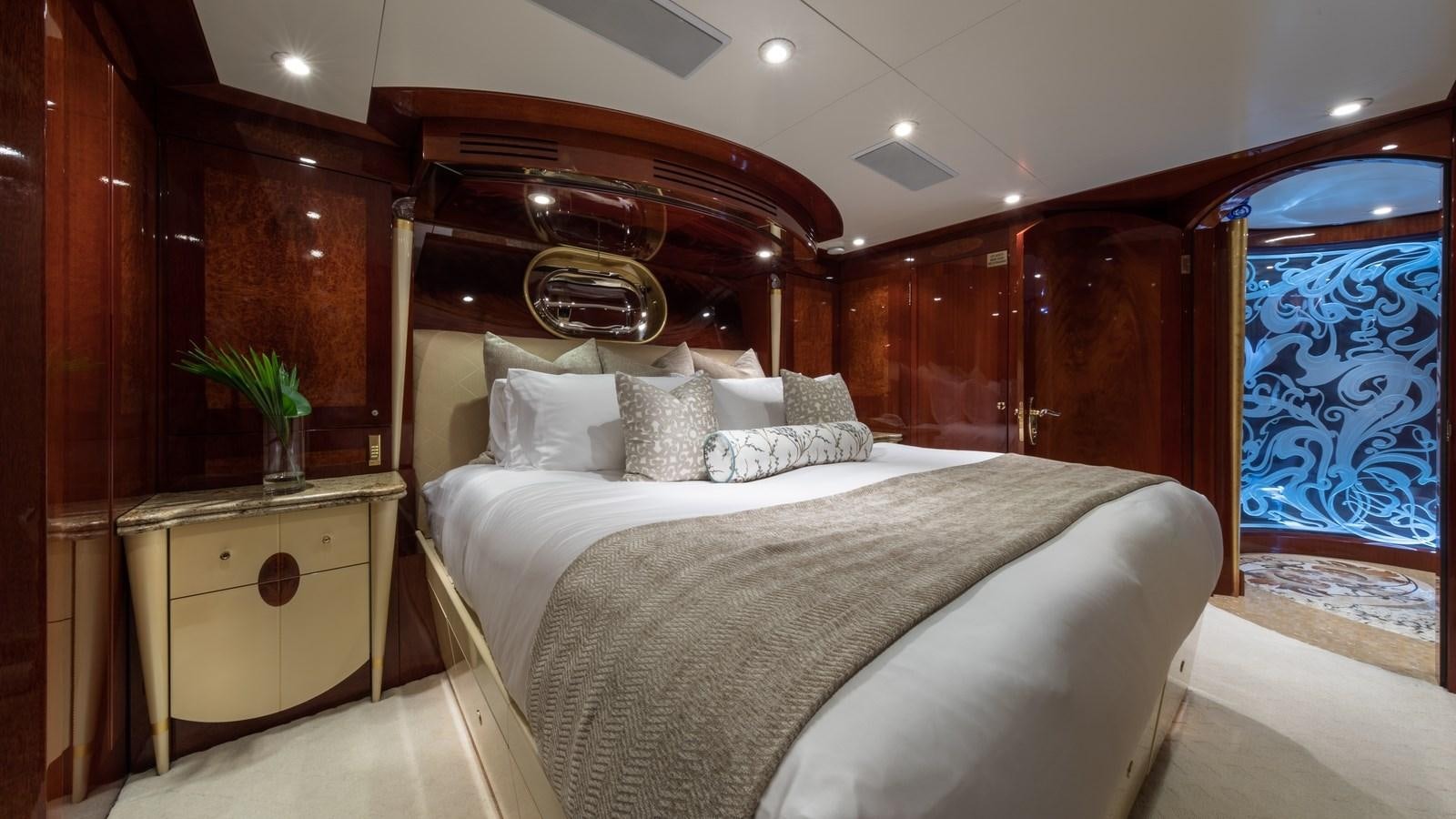 a bed with white sheets aboard TOUCH Yacht for Sale