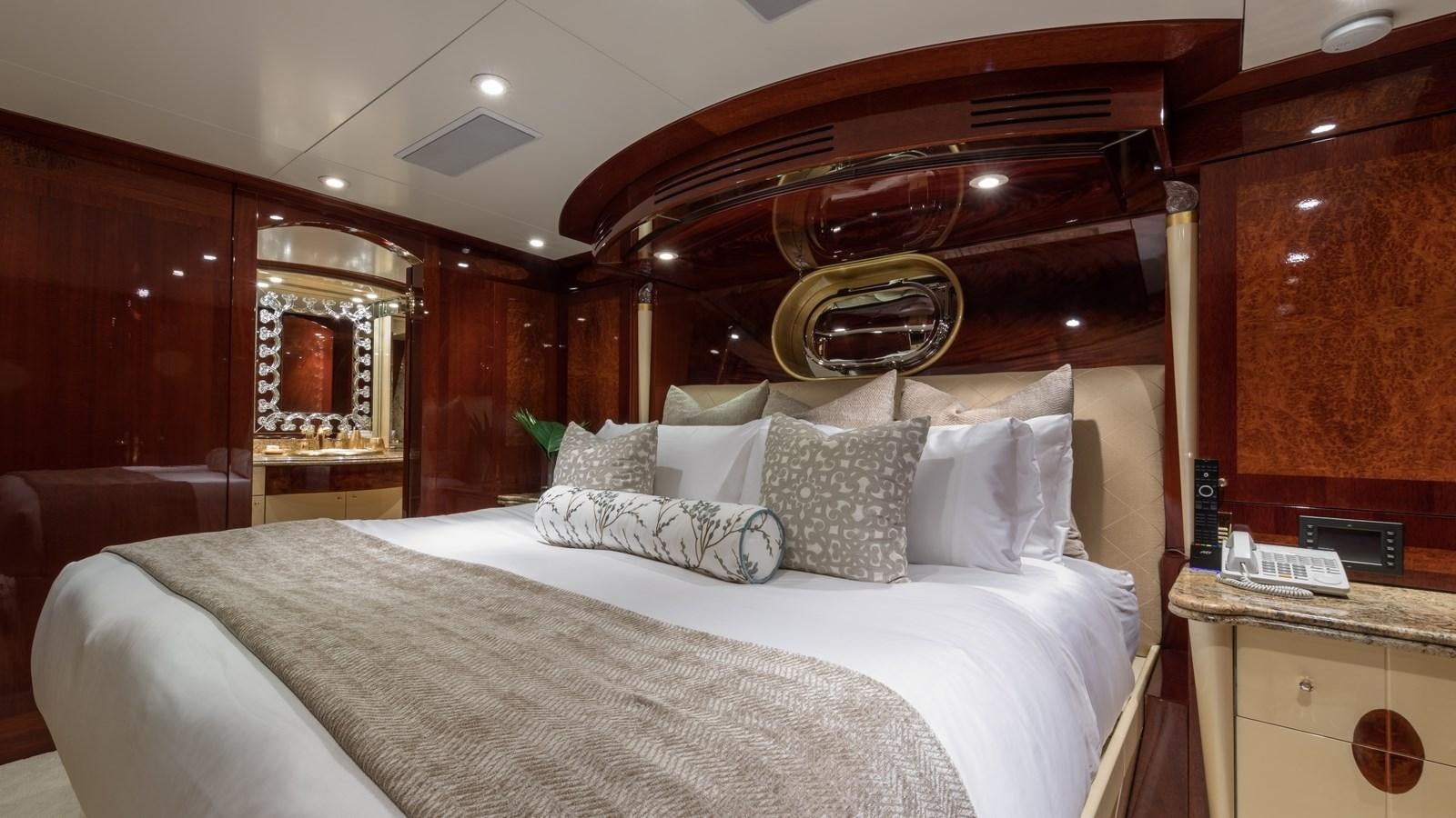 a bed with white sheets aboard TOUCH Yacht for Sale