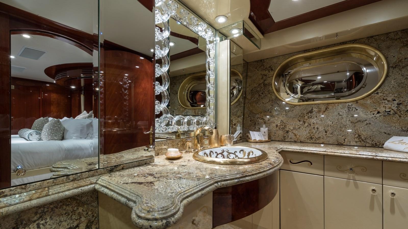 a bathroom with a marble countertop aboard TOUCH Yacht for Sale