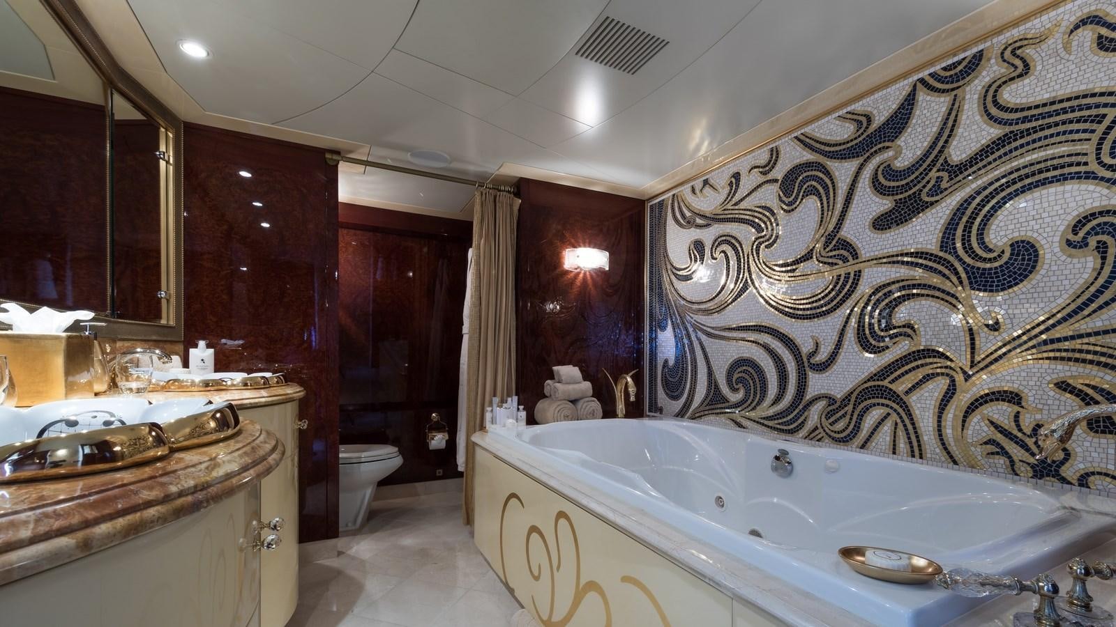a large bathroom with a bathtub aboard TOUCH Yacht for Sale