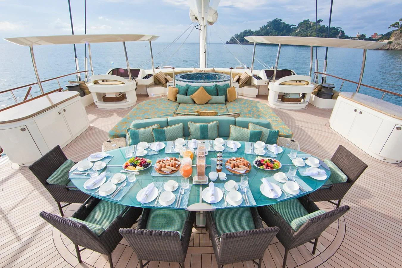 The aft deck features an elegant dining area with a stunning view of the sea. aboard HEMISPHERE Yacht for Sale