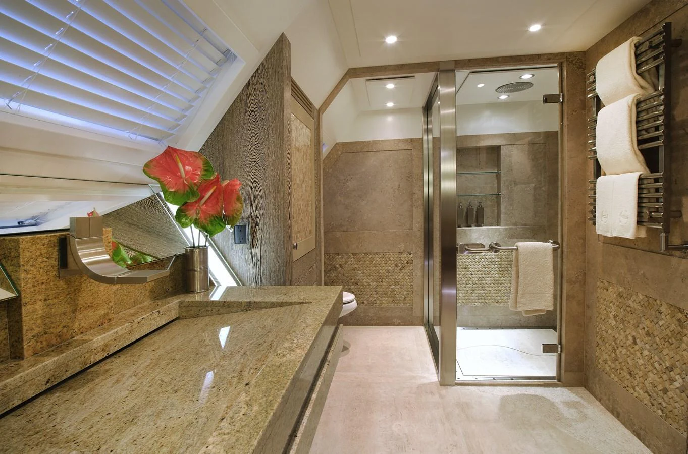 The yacht's bathroom features luxurious stone finishes and modern fixtures. aboard HEMISPHERE Yacht for Sale