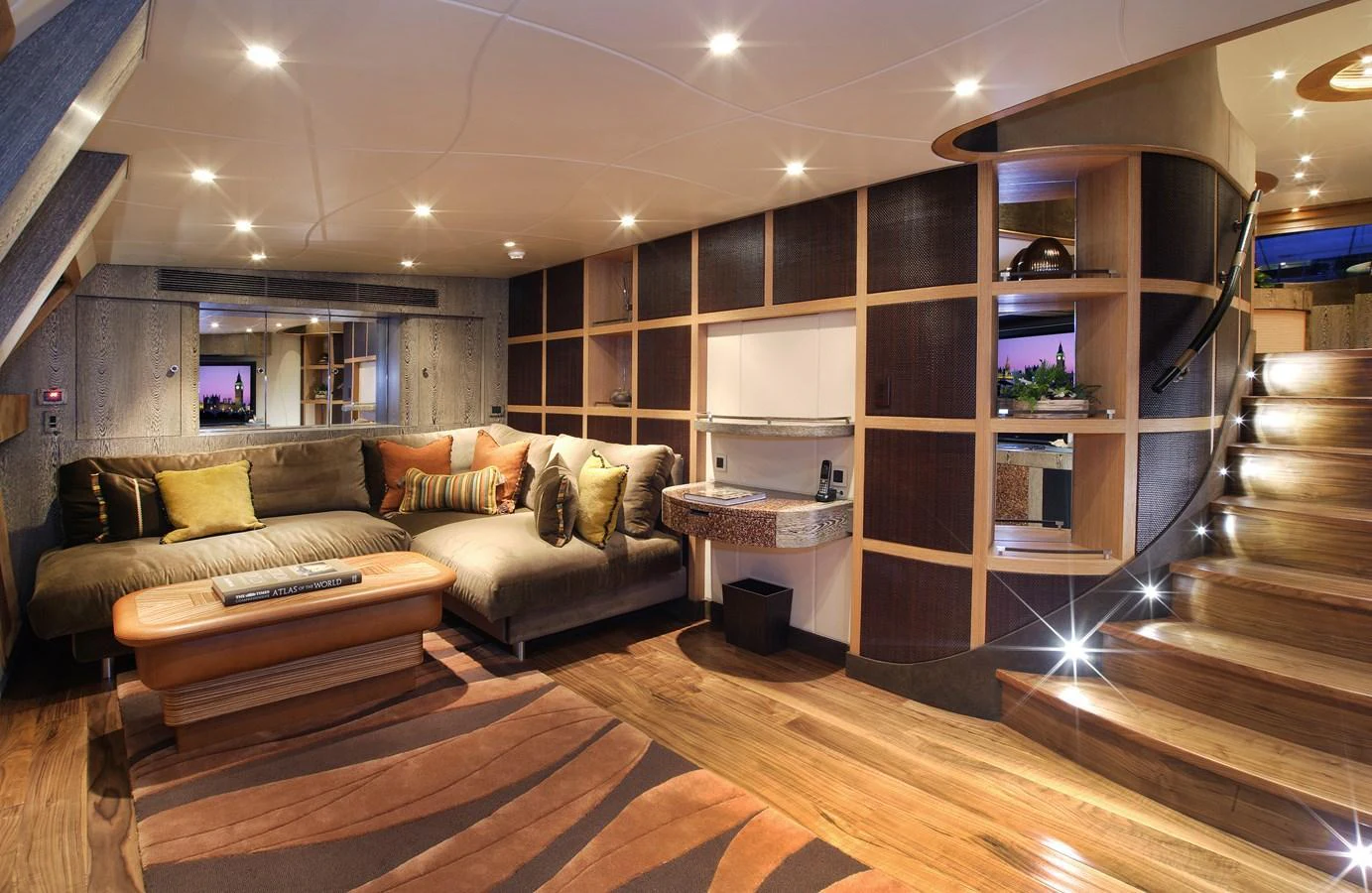 The salon features a cozy seating area with modern decor and ambient lighting. aboard HEMISPHERE Yacht for Sale