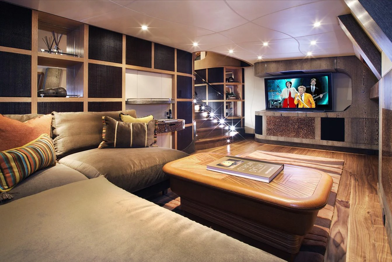 The yacht's lounge offers a cozy and stylish space with plush seating and a large TV for entertainment. aboard HEMISPHERE Yacht for Sale