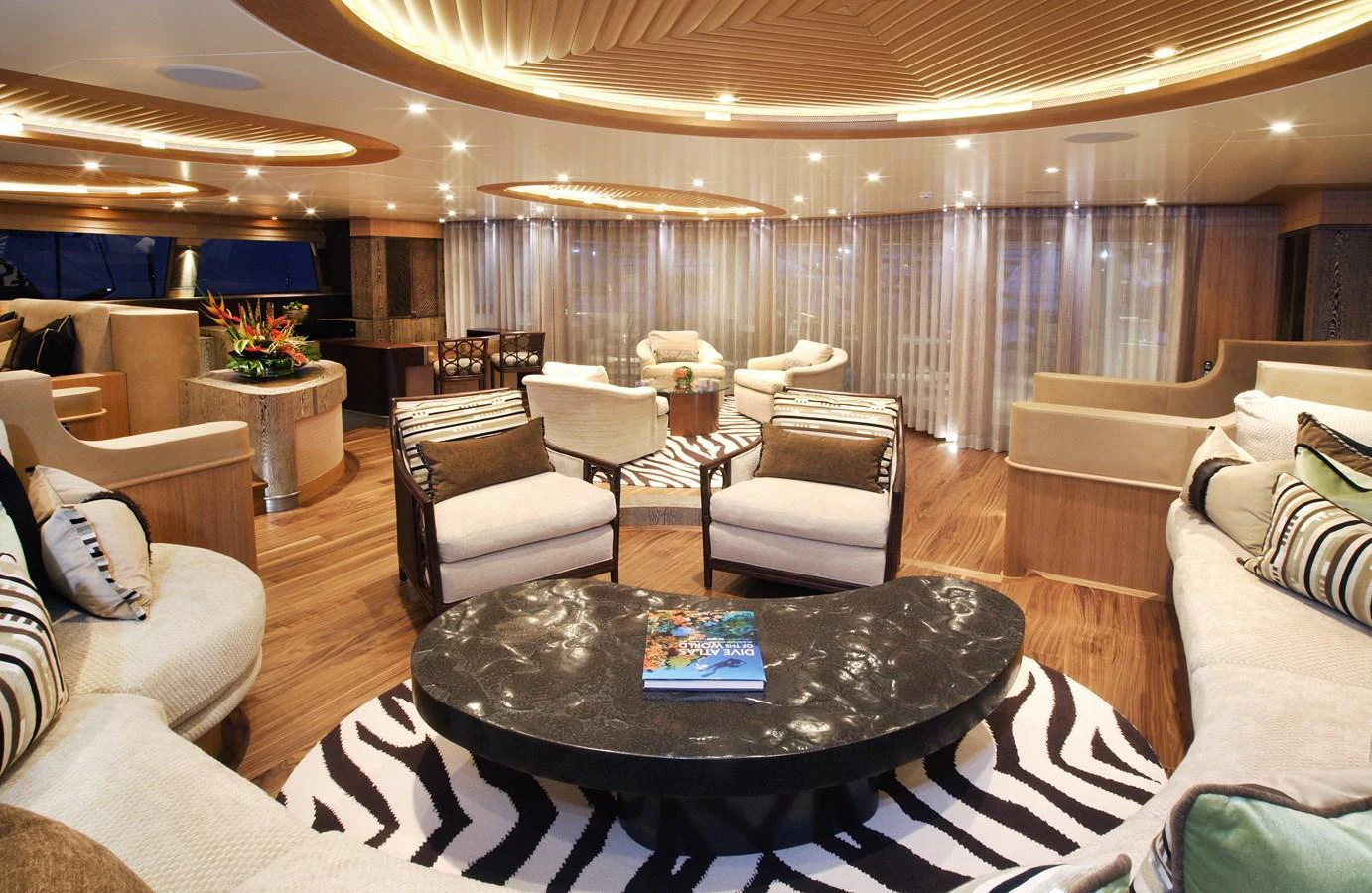 The yacht's interior features a spacious and elegantly designed lounge area with luxurious seating and modern decor. aboard HEMISPHERE Yacht for Sale