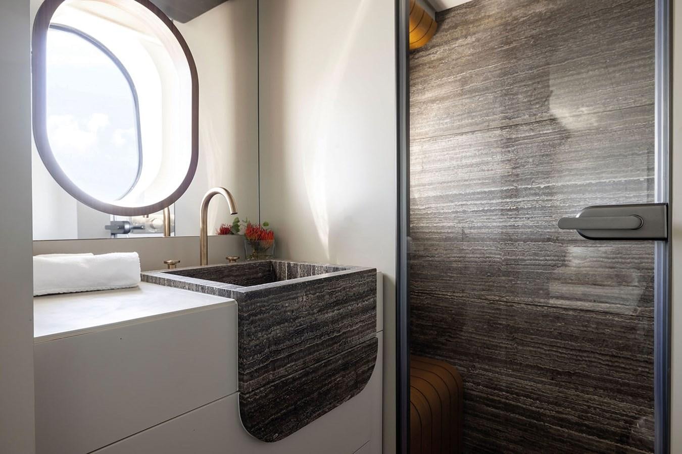 a bathroom with a sink and a mirror aboard MAGELLANO Yacht for Sale