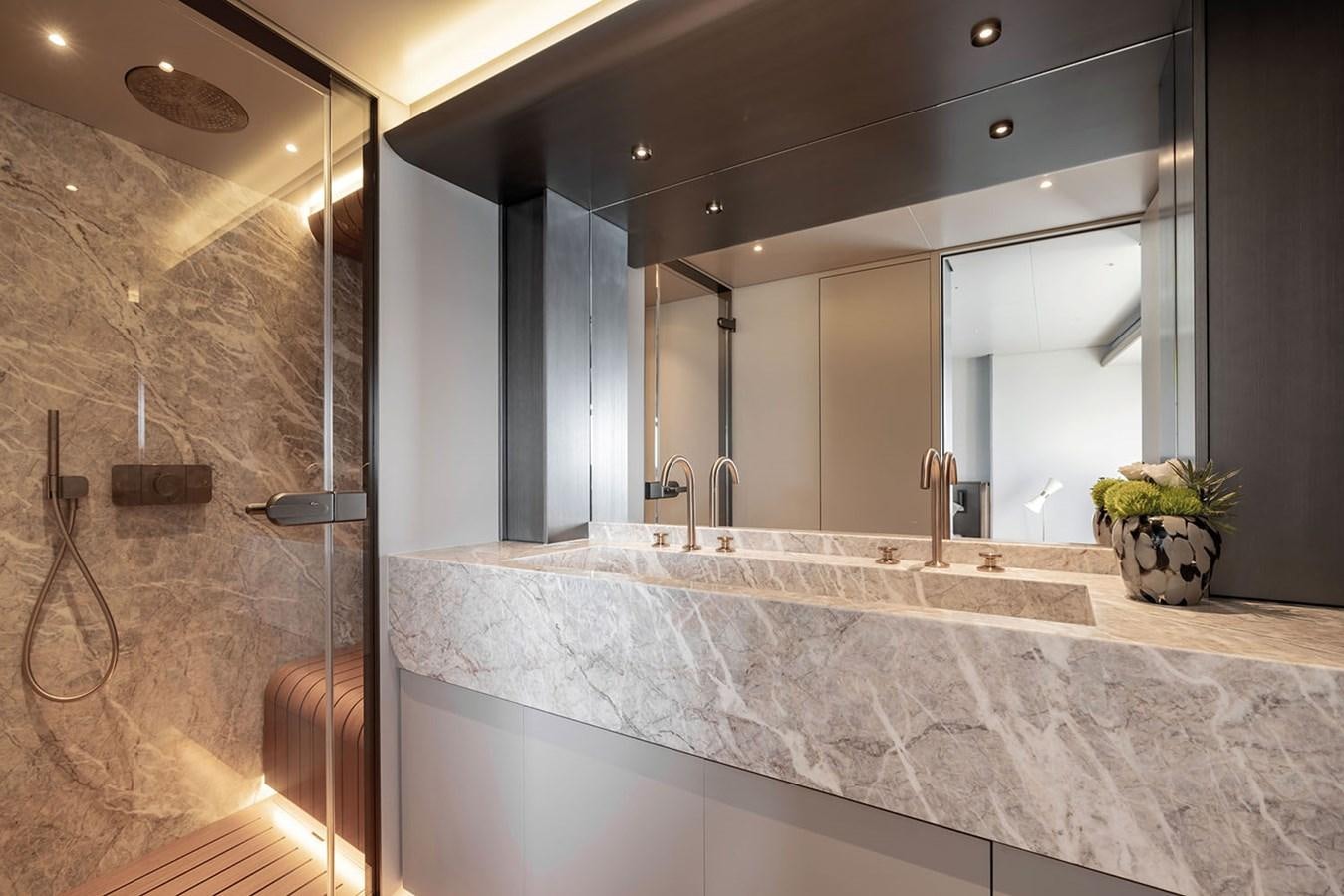 a bathroom with a marble countertop aboard MAGELLANO Yacht for Sale