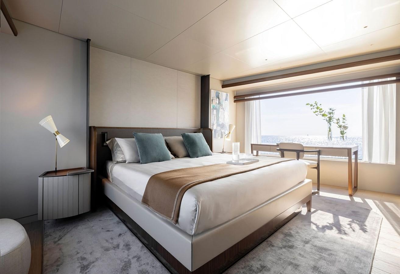 a bedroom with a bed and a table aboard MAGELLANO Yacht for Sale