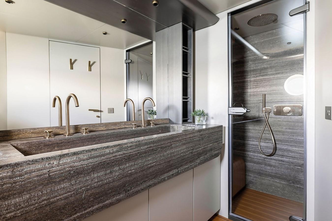 a bathroom with a large marble countertop aboard MAGELLANO Yacht for Sale