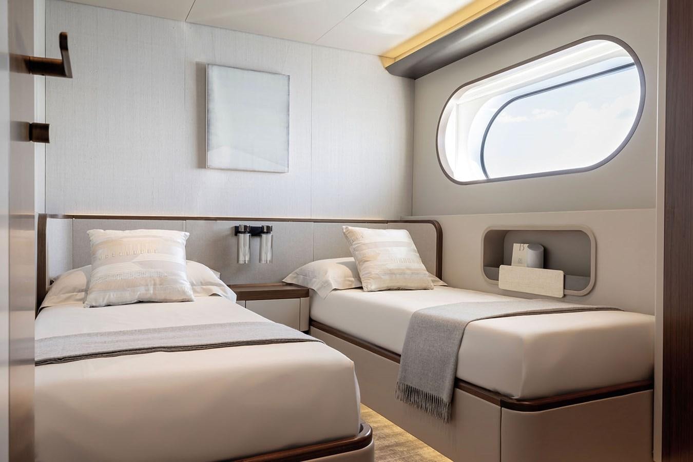 a room with two beds aboard MAGELLANO Yacht for Sale